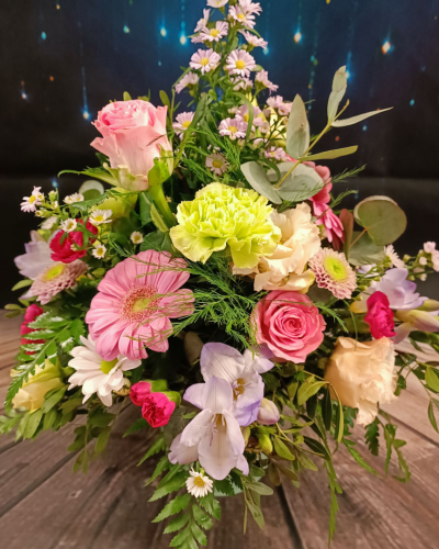 Cheerful Arrangement - An uplifting arrangement in a florist choice container, filled with cheerful and bright flowers that bring a sense of joy and happiness. Ideal for a get-well gift or to send a smile to a loved one.