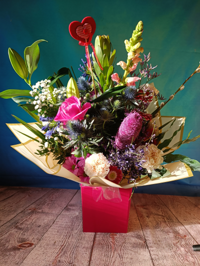 Sophisticated - Composition made out of Roses, Lilies, Antirrhinum, Carnations, Eryngium, pussy willow and Exotic Luffa.