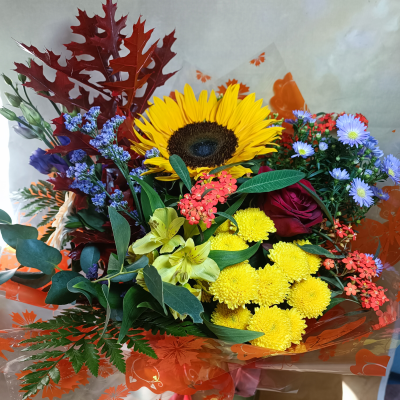A breath of autumn. - A beautiful autumn bouquet with a red rose and sunflower. Must include yellow, orange ,purple and red.