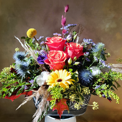 The gift of Autumn. - Composition in a metal container. It must contain three roses, purple flowers and natural filling including cotton buds.