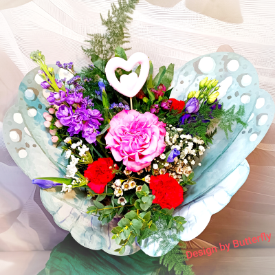 In the wings of butterfly - An extraordinary flower arrangement embraced by butterfly wings.