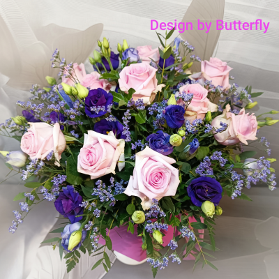 Exclusive hat box - Extra large ,hexagon hat box . At least ten first-quality pink roses with purple accents.