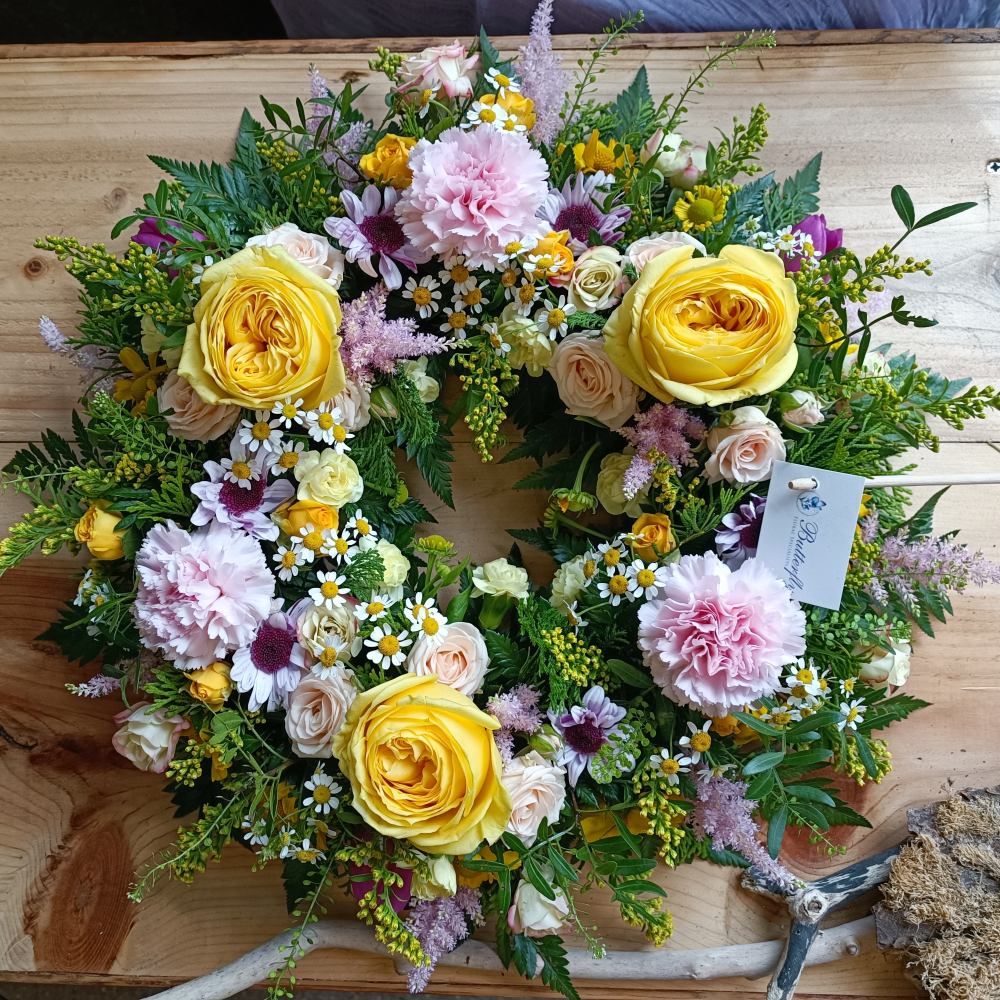 Pink and yellow funeral wreath