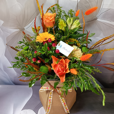 Autumn Symphony - Floral arrangement in a box featuring flowers in warm autumn tones.